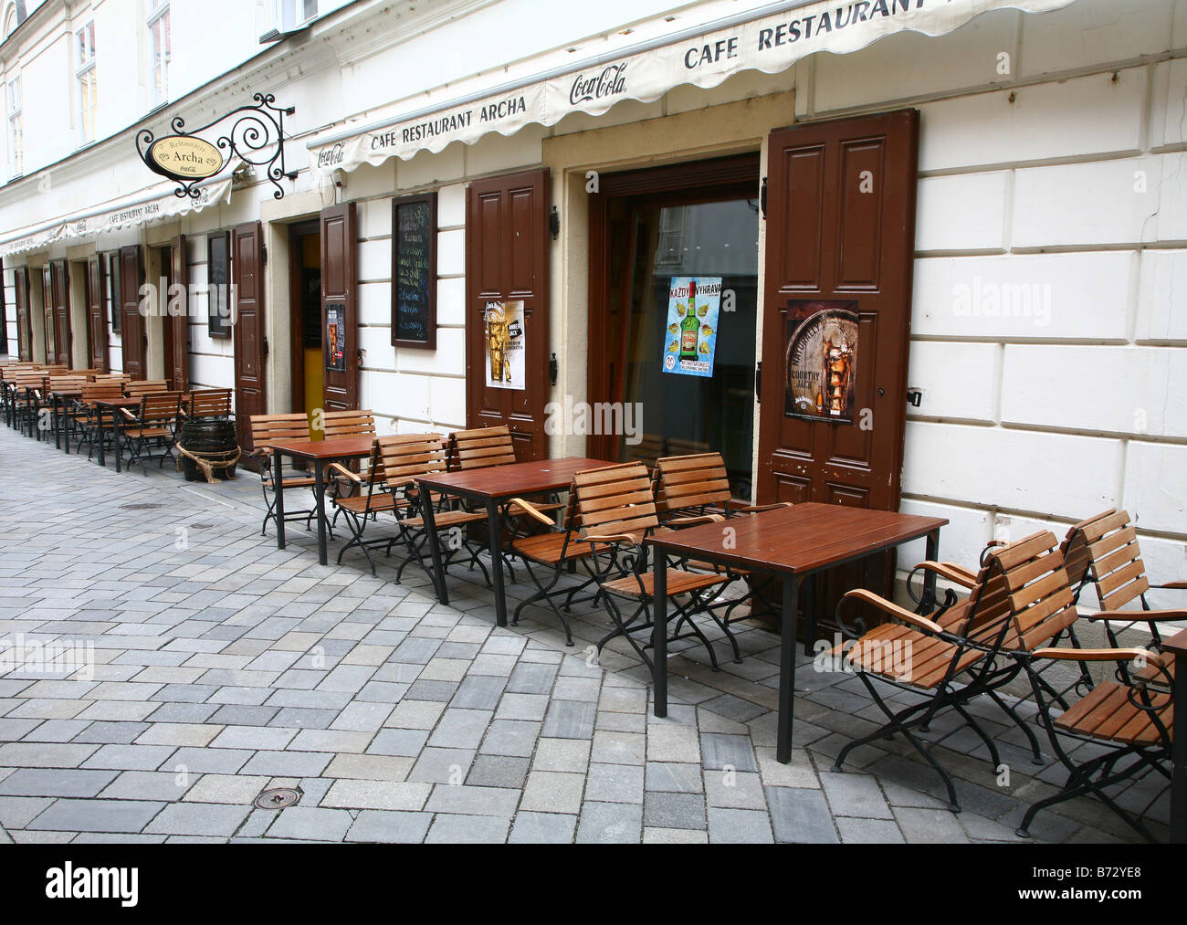 Street scene  in Bratislava,  Slovakia , chairs of a cafe bar in the street Stock Photo
