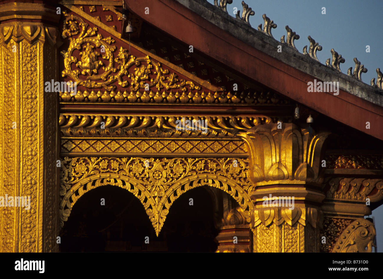 Golden Columns and Decorated East Facade of Wat Saen Buddhist Temple (1718), Luang Prabang, Laos Stock Photo