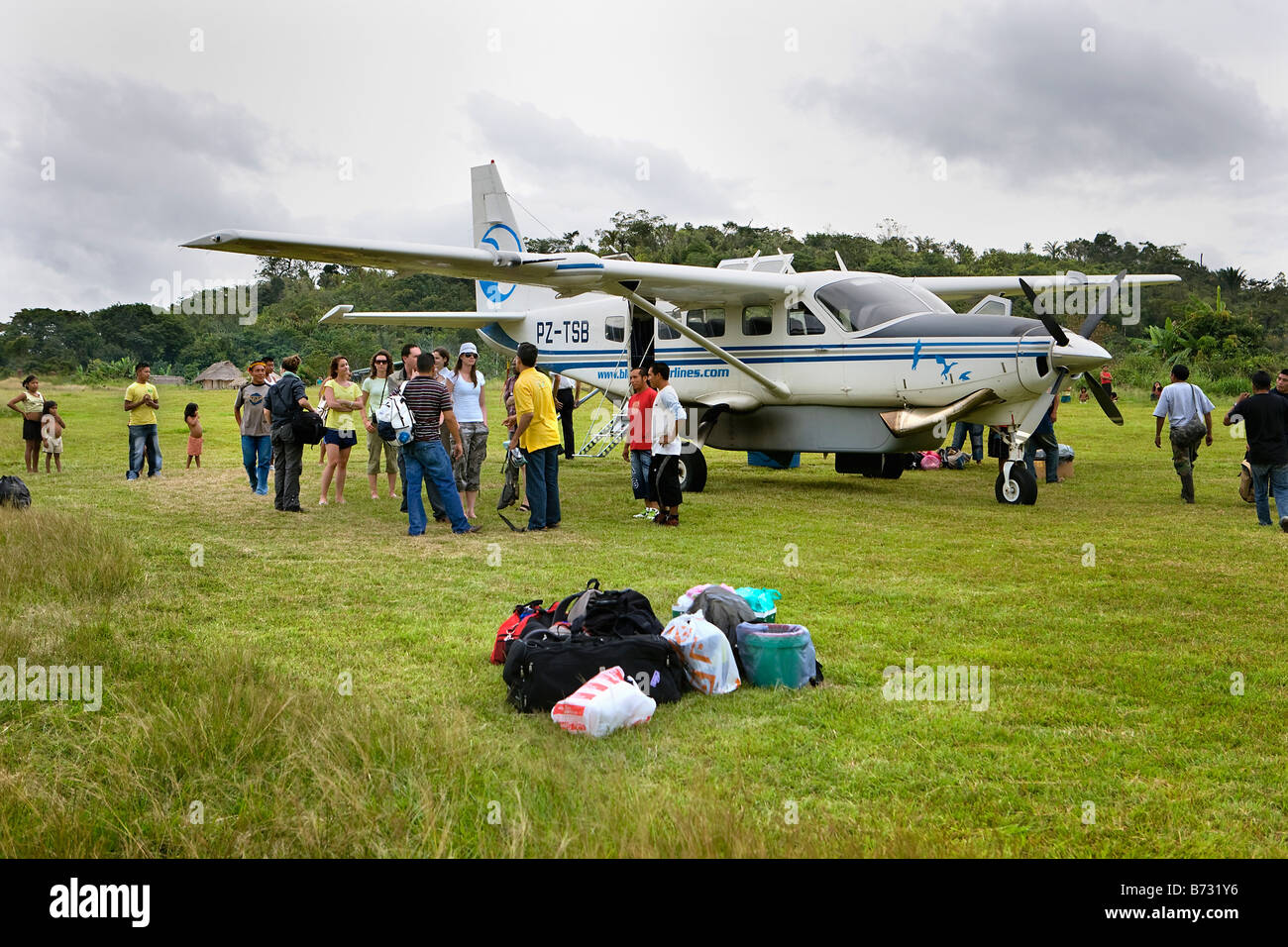 Suriname, Kwamalasamutu, home of indigenous Indians. Tourists arriving with small airplane. Stock Photo