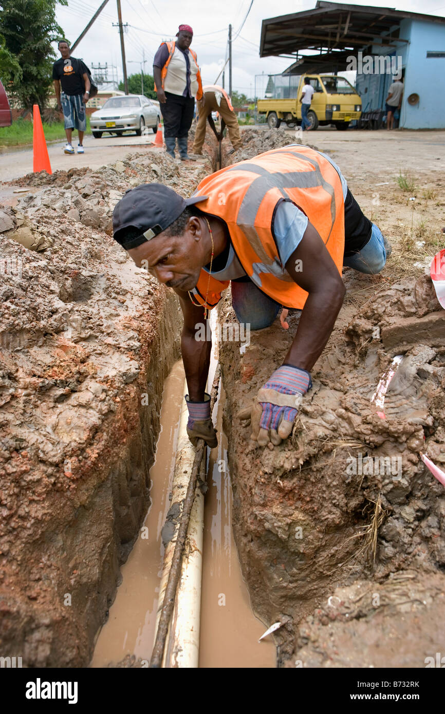 Suriname, Paramaribo, Municipal waterworks putting waterpipes. Stock Photo