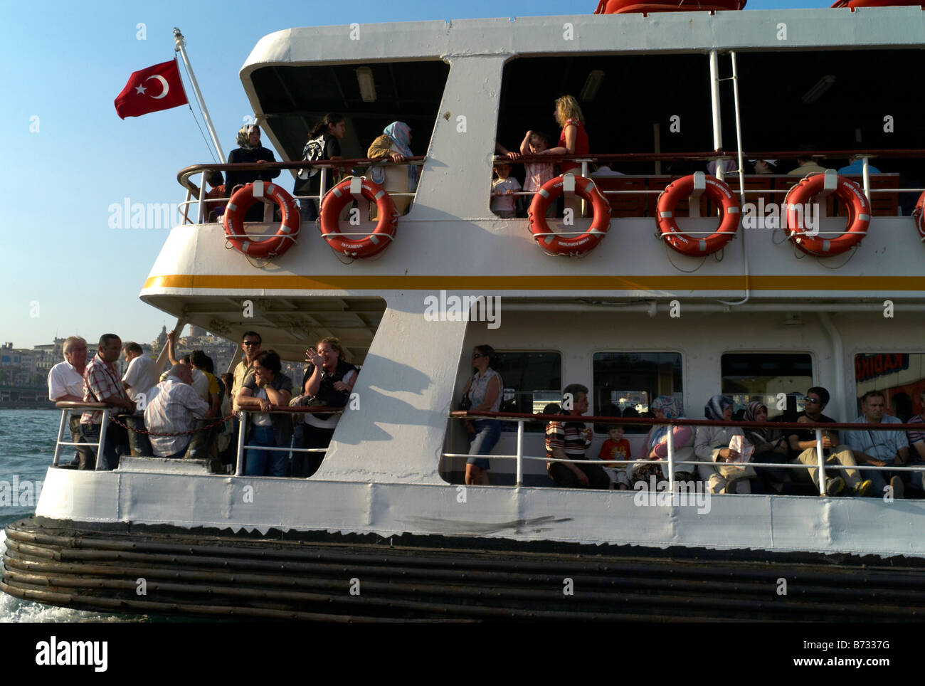A ferry on the Bosphorous in Istanbul Turkey pulling away from Kadikoy ...