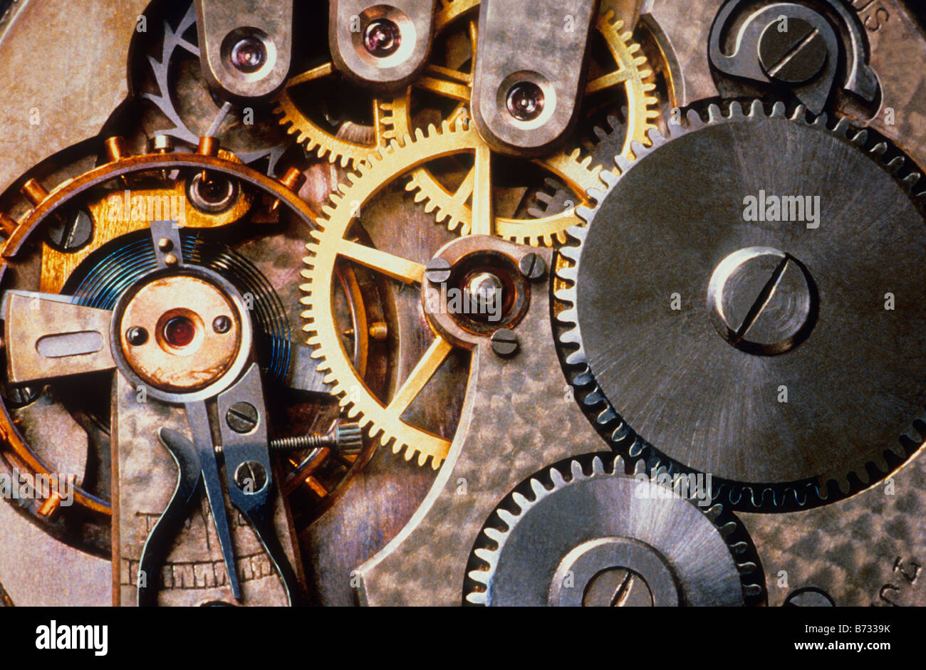 Gears. Clock mechanical gears close up. Interior of watch mechanism. Timepiece and interlocking circular cogs. Time Stock Photo