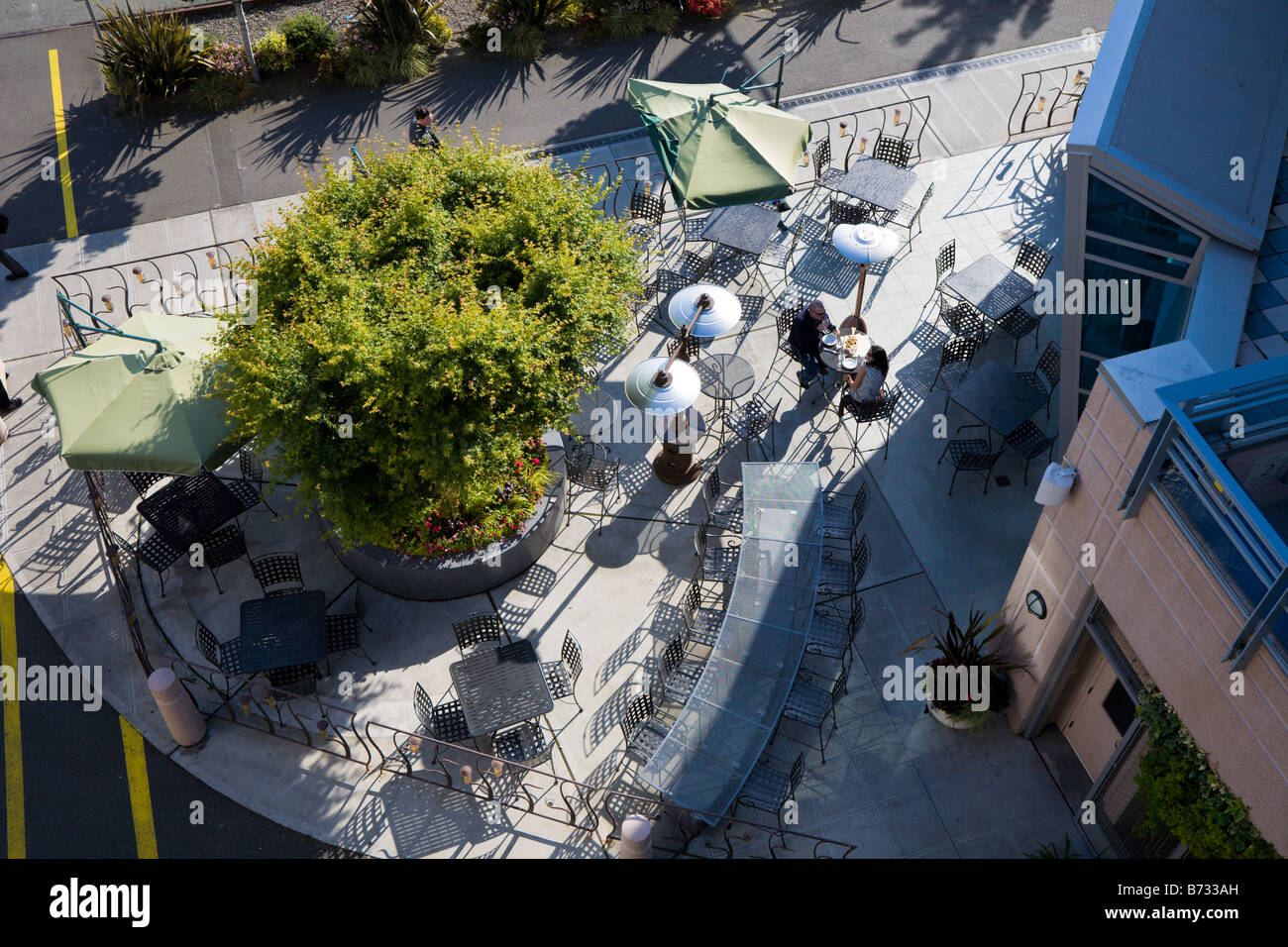 A couple sits on outdoor patio in downtown Seattle, Washington, USA
