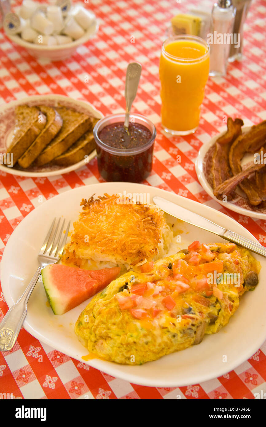 vegetarian omelette hash browns watermelon thick sliced bacon and toast