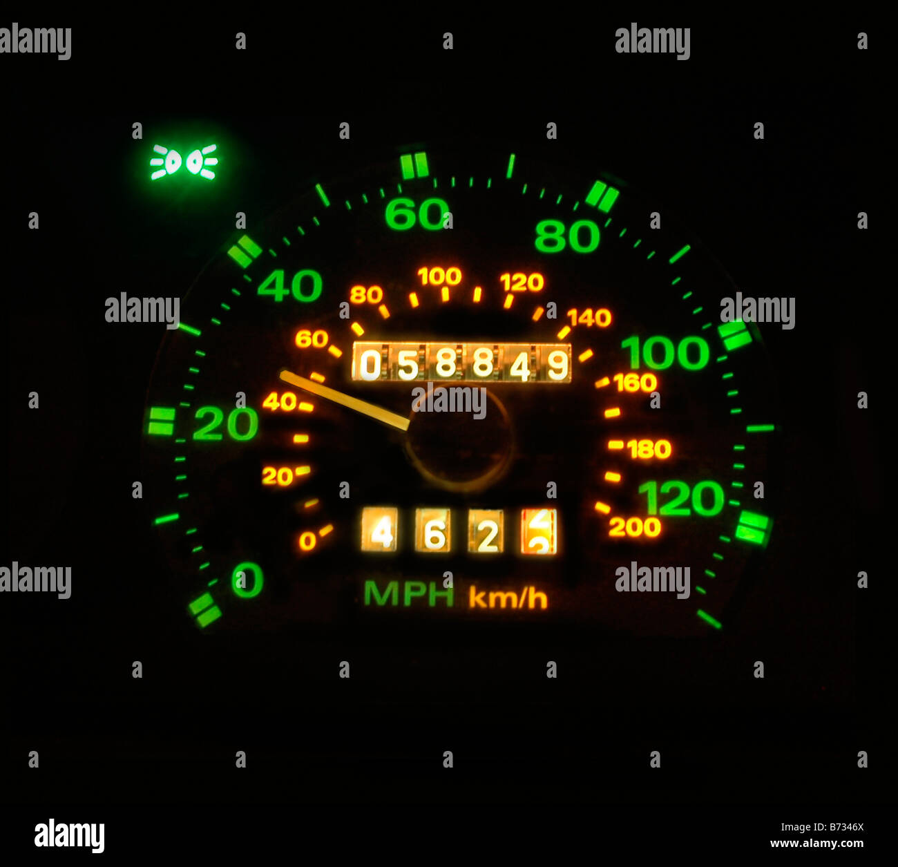 A lit speedometer in a car indicating traveling speed of 30mph Stock