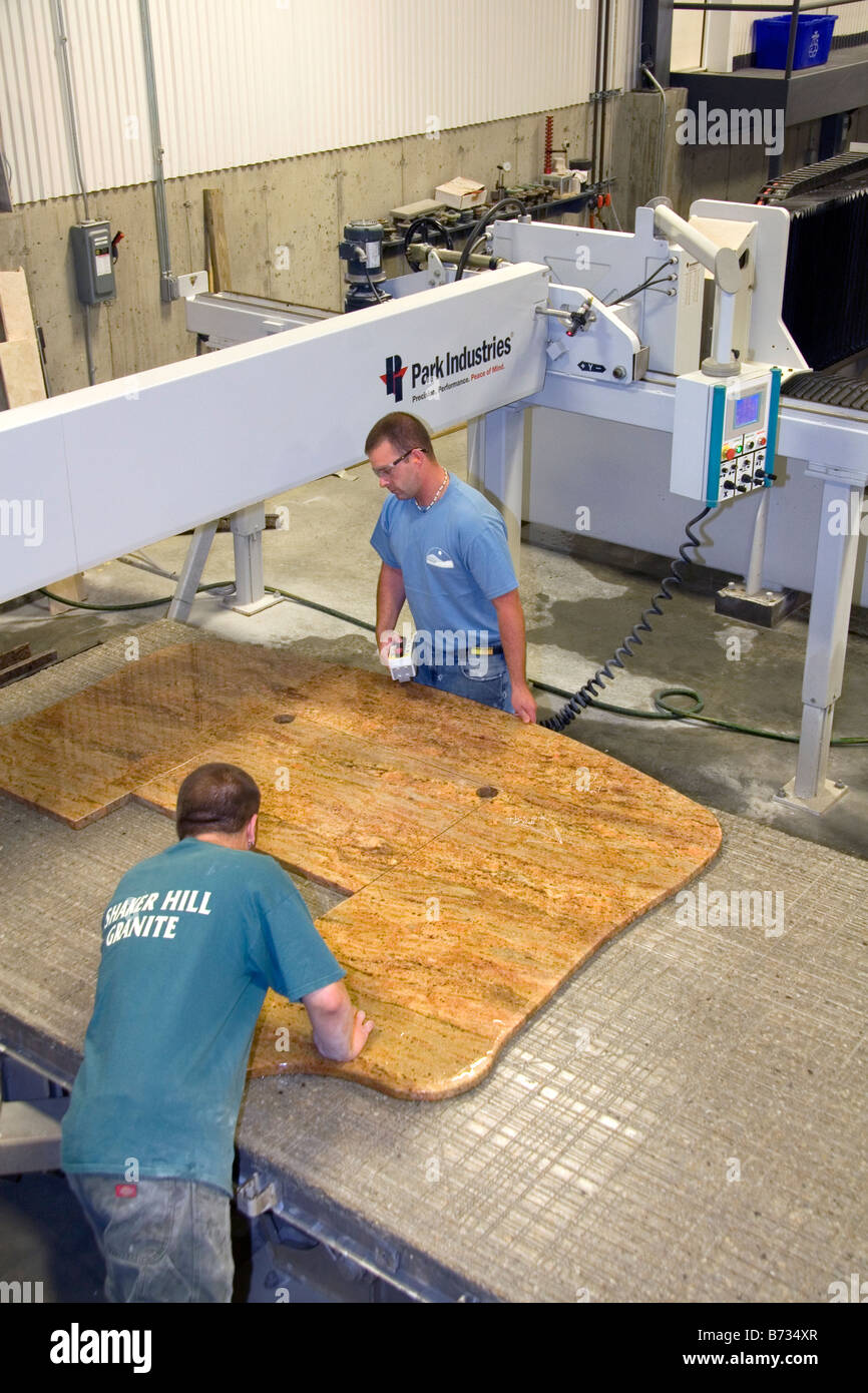 Workers Custom Cutting A Granite Countertop At The Shaker Hill