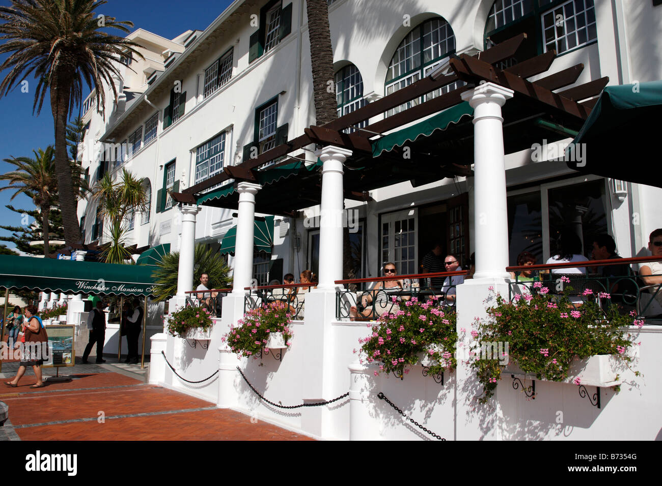 entrance of the winchester mansions hotel and harvey's bar along beach road sea point cape town south africa Stock Photo