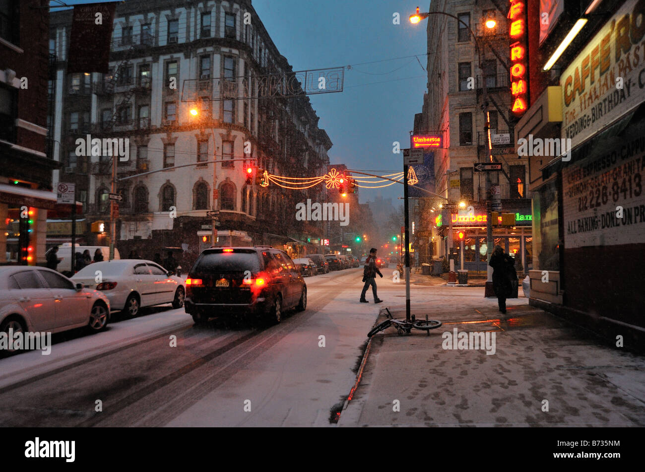 Evening snow on Mulberry Street in New York City winter in Little Italy. Stock Photo