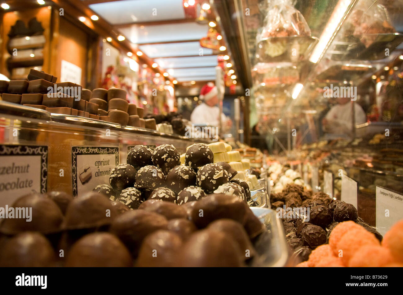Chocolates and confectionary on display at a market with counter in the background Stock Photo