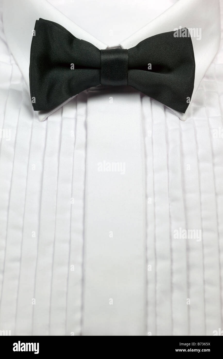 Black silk bow tie and white cotton dress shirt Stock Photo