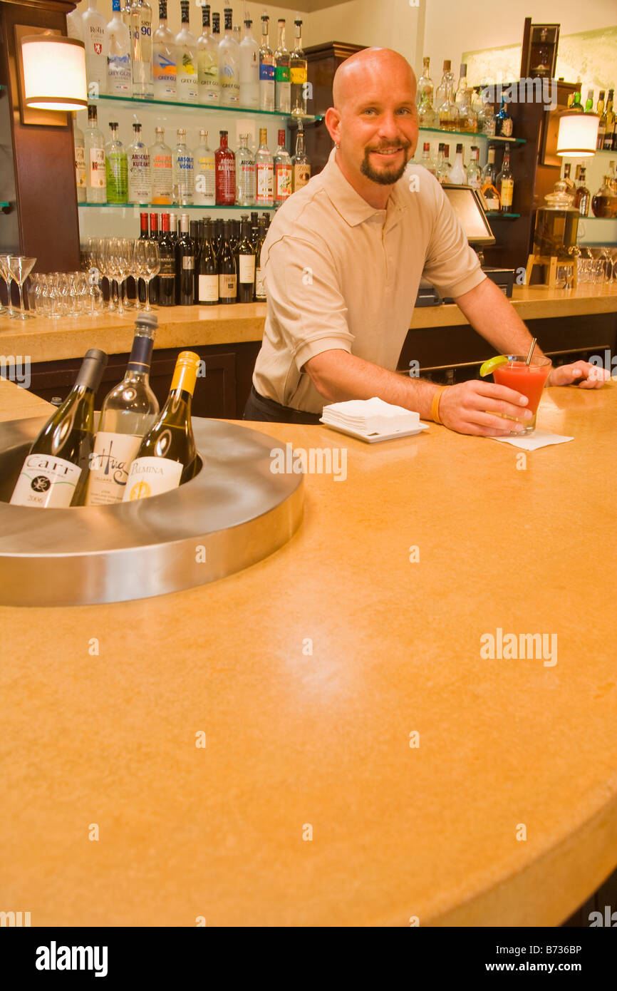 Bartender serves drink in hi-res stock photography and images - Alamy