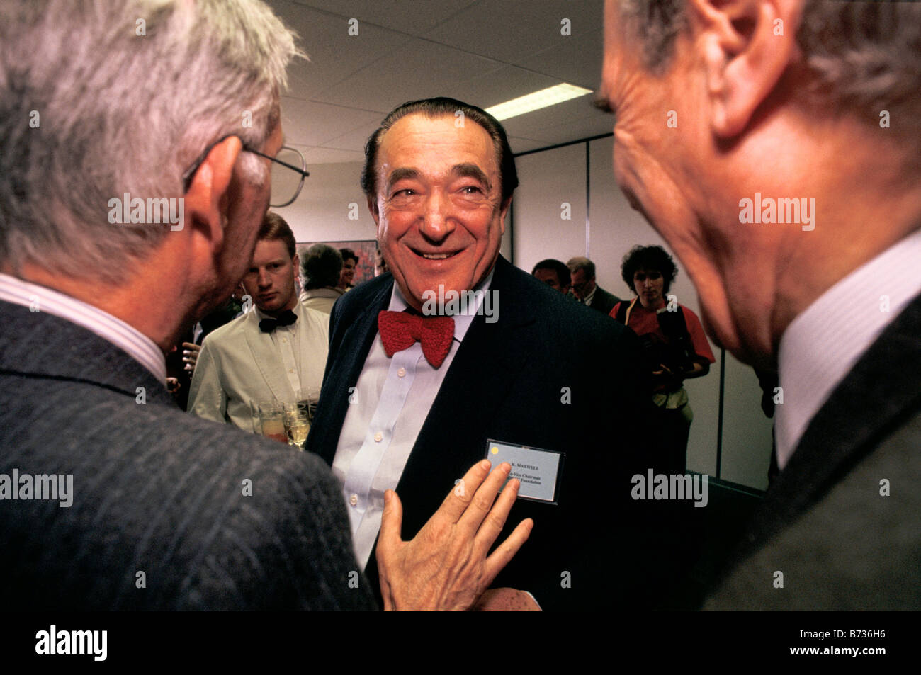 Robert Maxwell (right),  media mogul and owner of Mirror Group Newspapers,  arrives at a cancer charity event in Bruxelles. Stock Photo