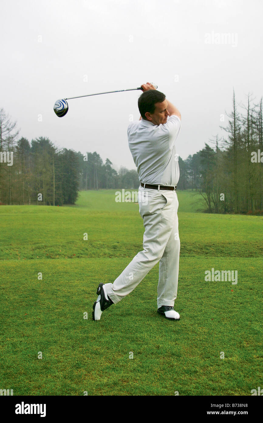 Golfer on top of backswing Stock Photo