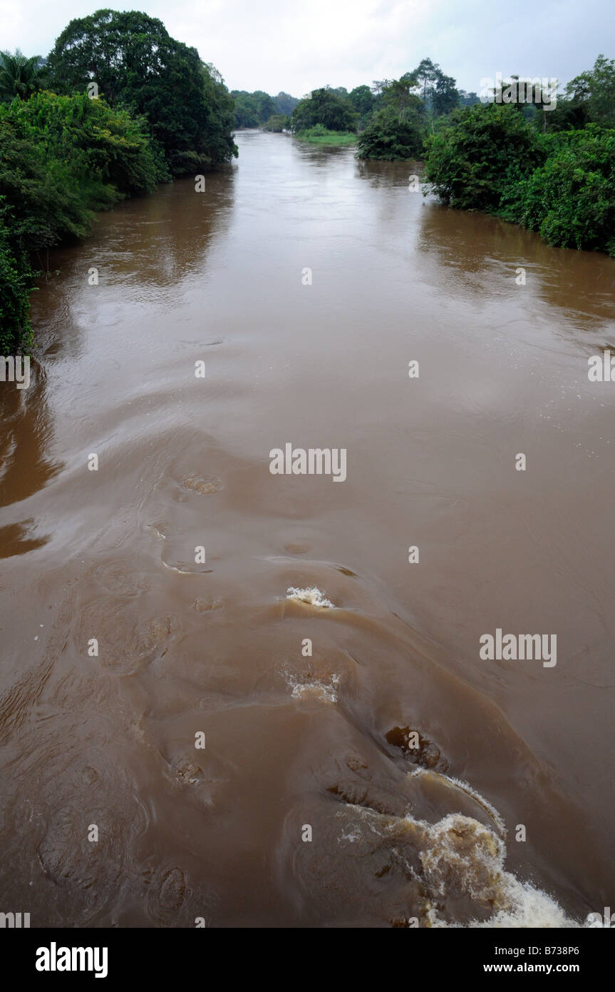 Eddy in swollen muddy brown Saint John River Liberia Stock Photo