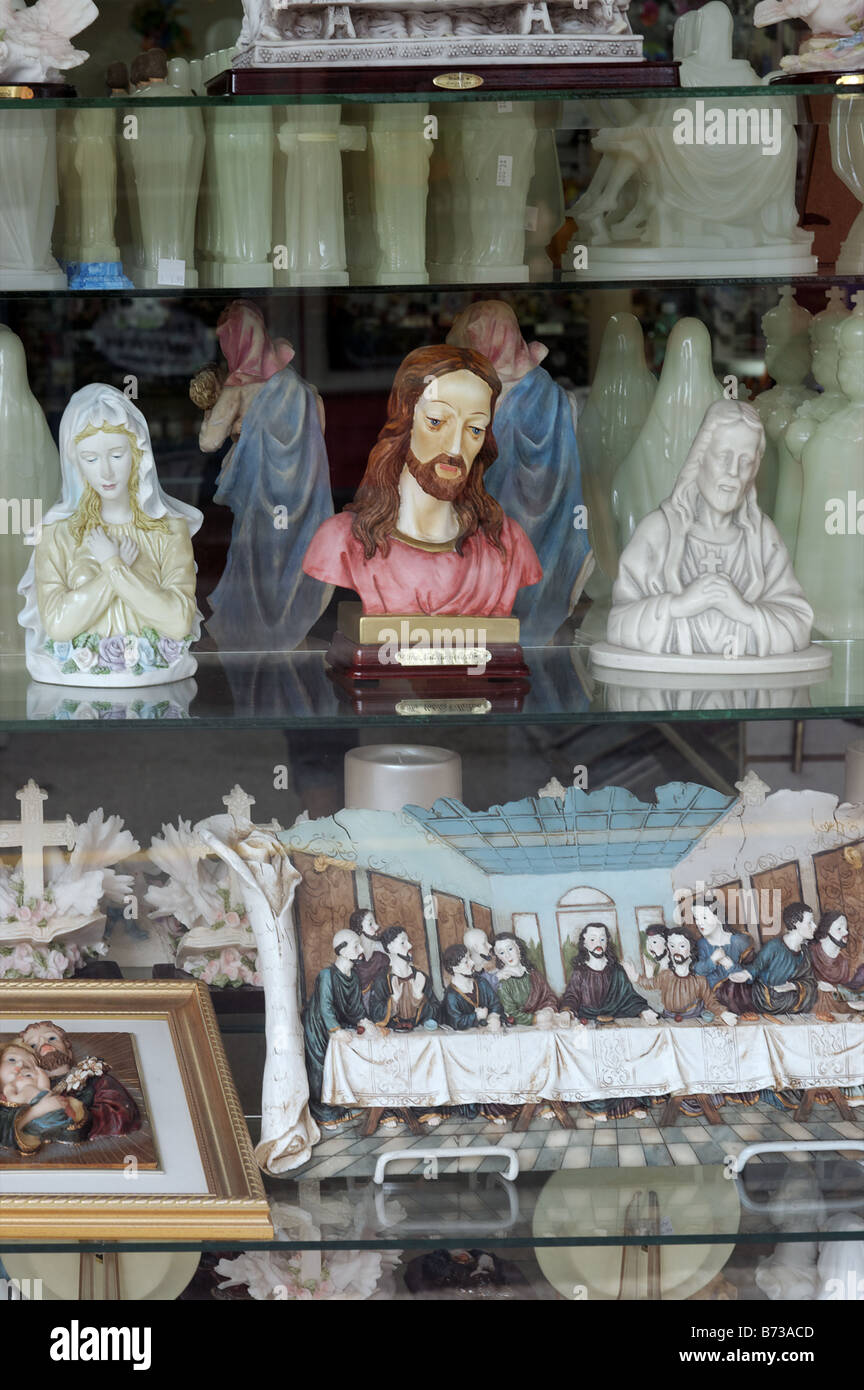 Statues of Jesus and Mary in a shop window Stock Photo