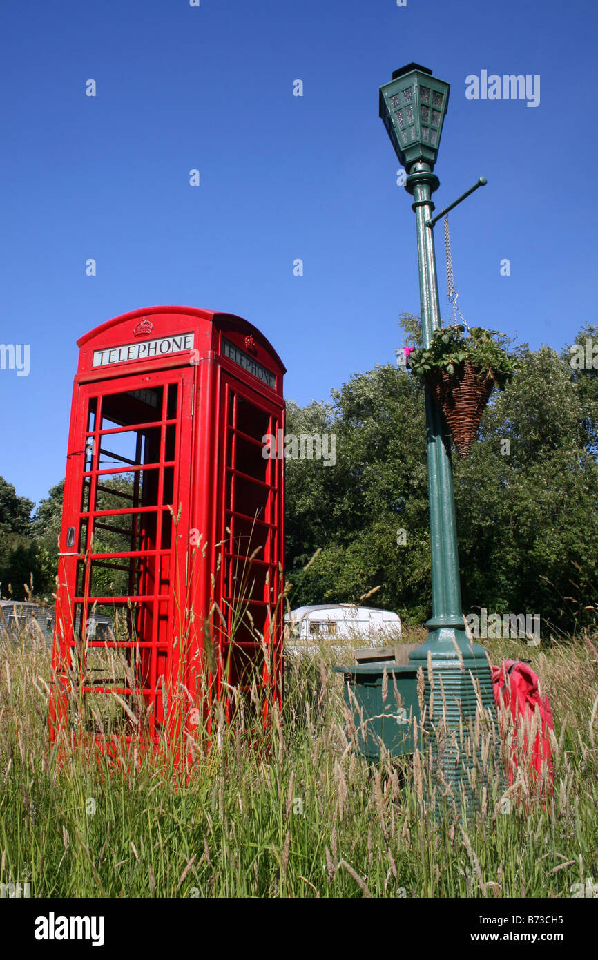 TELEPHONE BOX, LAMP POST AND CARAVAN IN BLACKBERRY WOOD CAMPSITE. Stock Photo