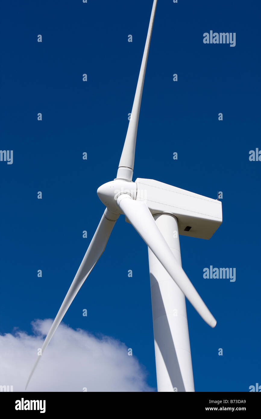 A wind turbine against a blue sky Stock Photo - Alamy