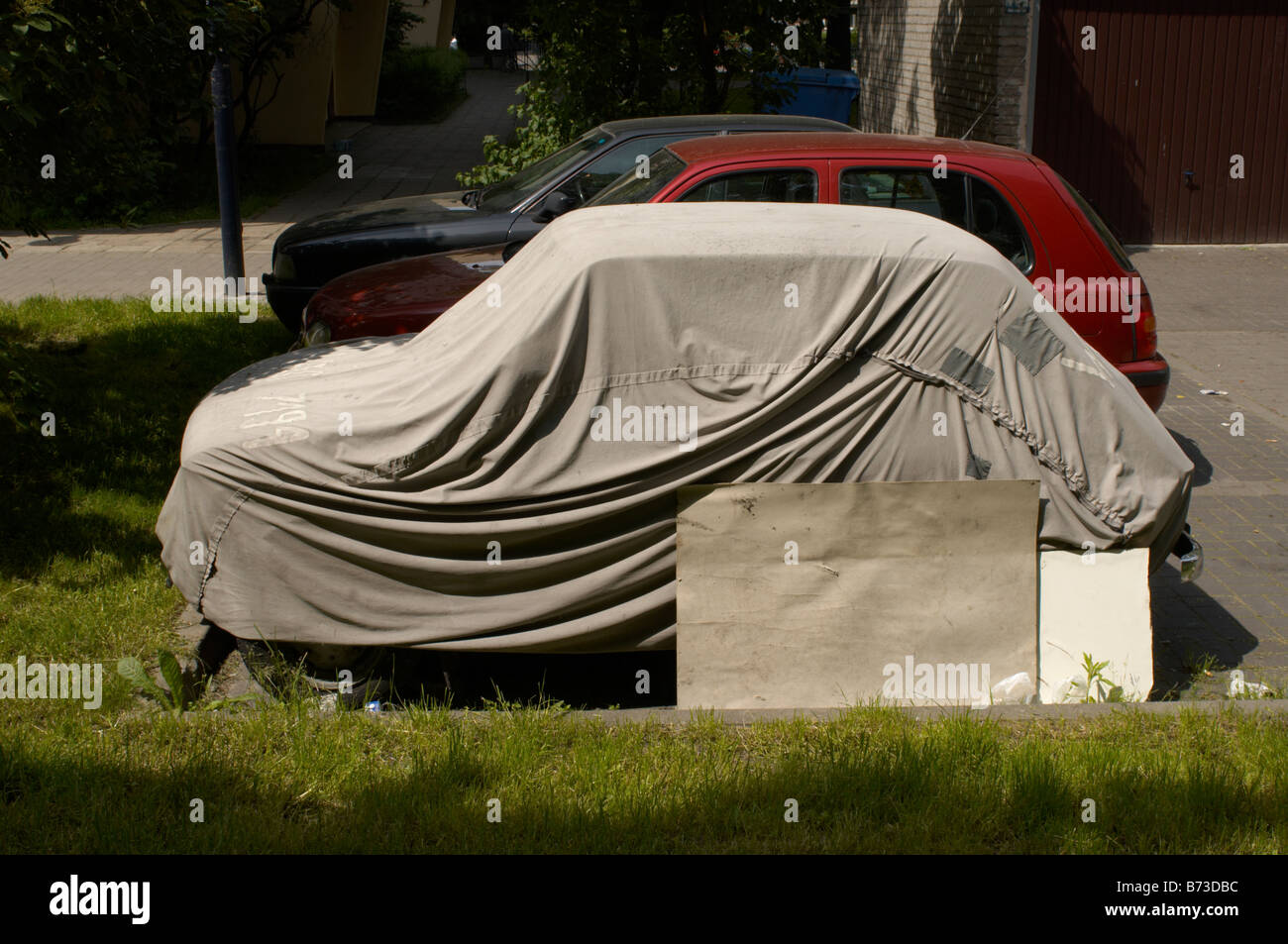A car under wraps in central Warsaw Stock Photo