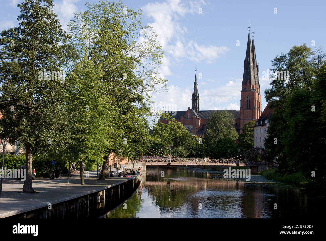 People next to the River Fyris and the cathedral, Uppsala, Sweden Stock ...