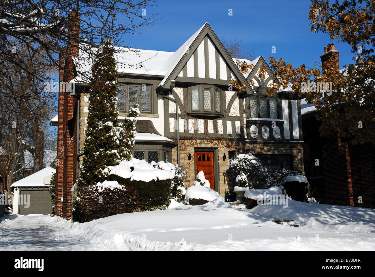 Tudor style house on a snowy day Stock Photo