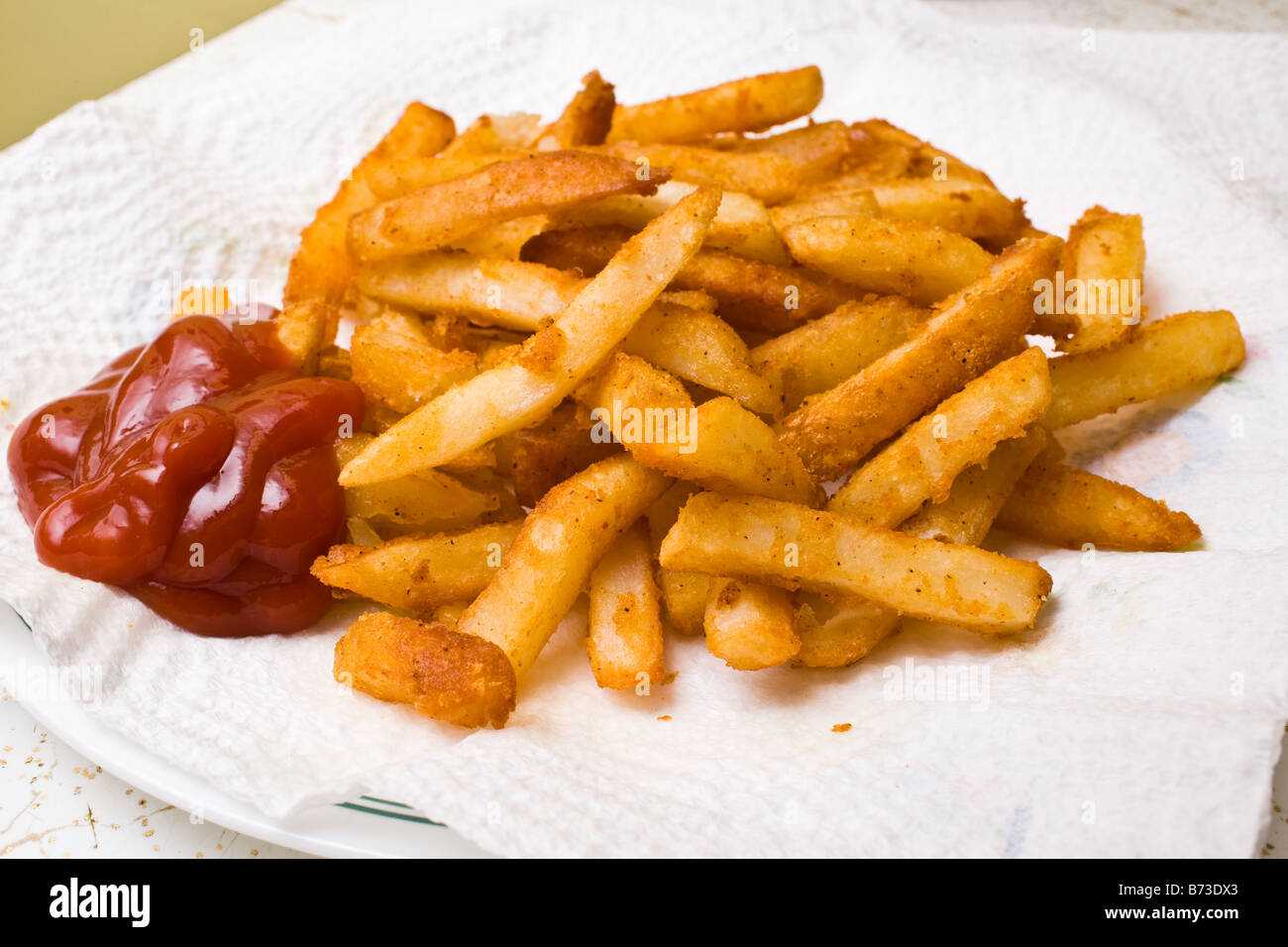Hot french fries and ketchup Stock Photo