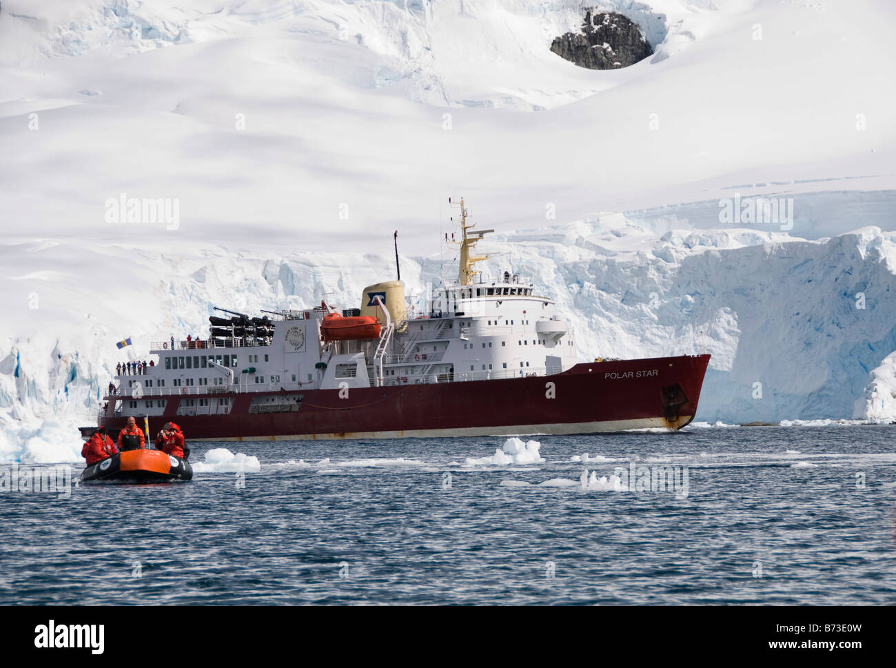 Icebreaker turned cruise ship the Polar Star landing a party of tourists in a Zodiac Stock Photo