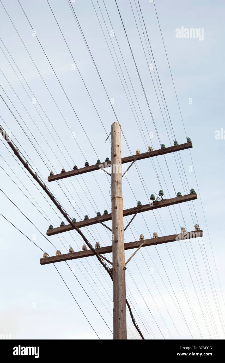 Utility pole with power and communication lines Stock Photo