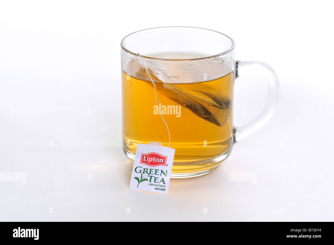 A cup of hot green tea isolated on a white background. USA Stock Photo