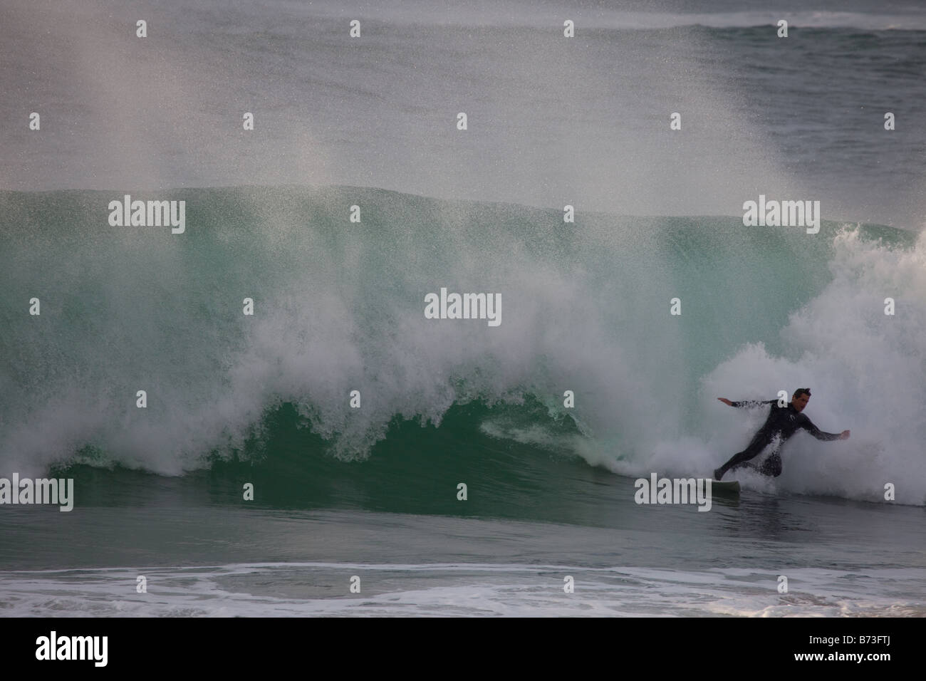 Surfer Wipe out at Guincho beach, Portugal Stock Photo