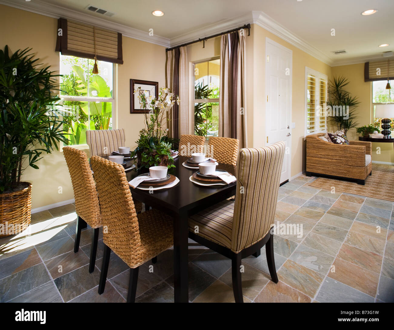 Dining room with tile floor and recessed lighting Stock Photo - Alamy