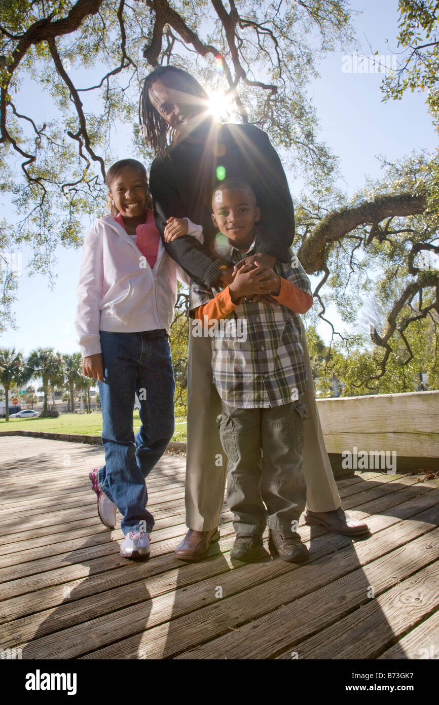 Young African American family outdoors in park Stock Photo - Alamy