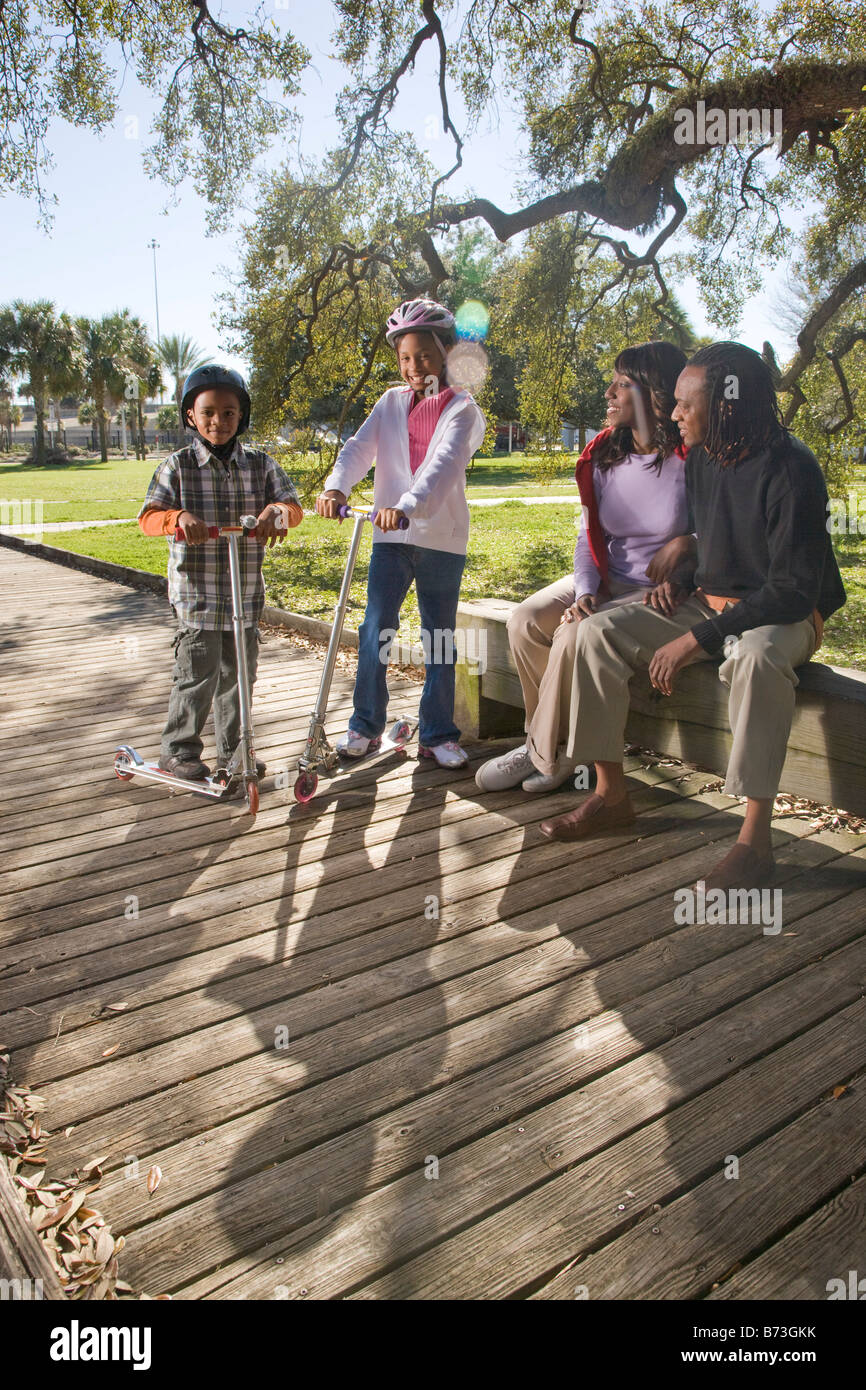 Young African American family outdoors in park Stock Photo - Alamy