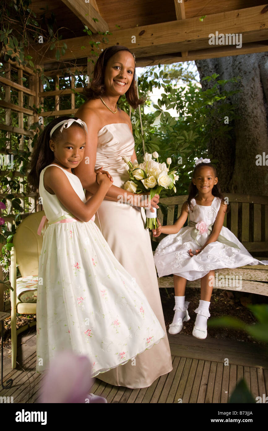 Happy African American Bride With Flower Girls On Wedding Day