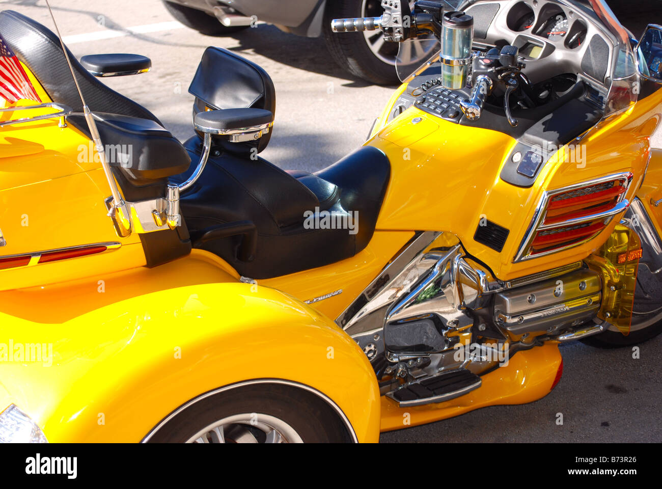 Bright Yellow Honda three wheel motorcycle Stock Photo