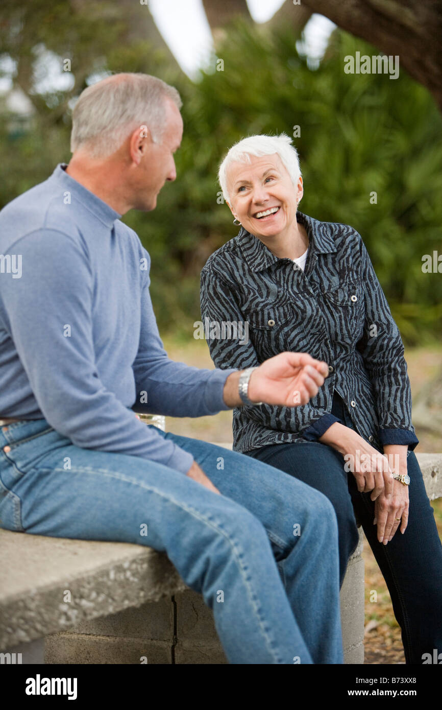 Woman sitting on park talking hi-res stock photography and images - Alamy