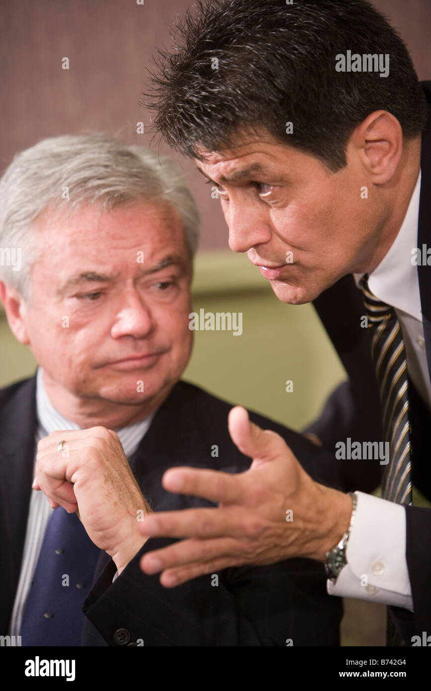 Two multi-racial businessmen having discussion in meeting room Stock Photo