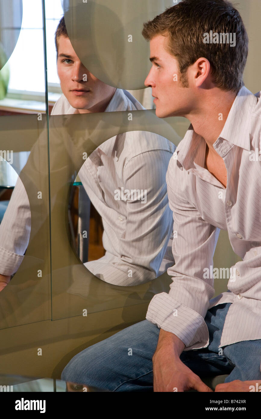 Serious man looking reflection hi-res stock photography and images - Alamy