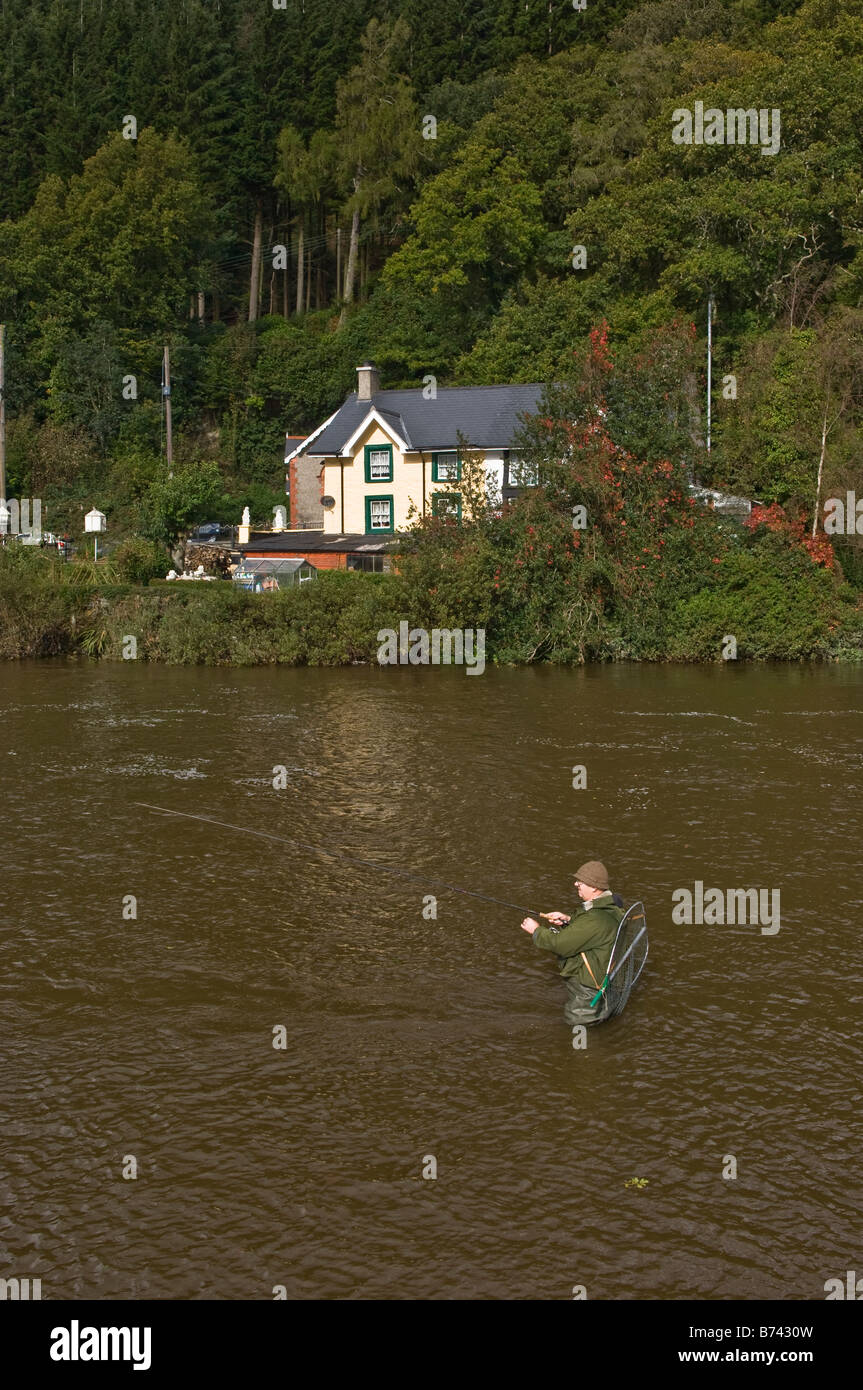 Angler fishing for salmon on the River Dovey at Dyfi Bridge Machynlleth Powys Stock Photo