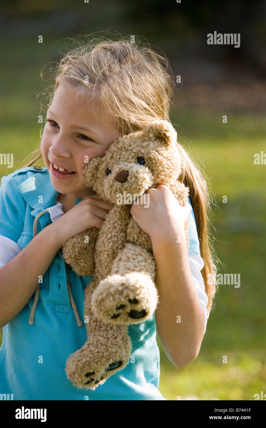 Child with teddy bear hi-res stock photography and images - Alamy