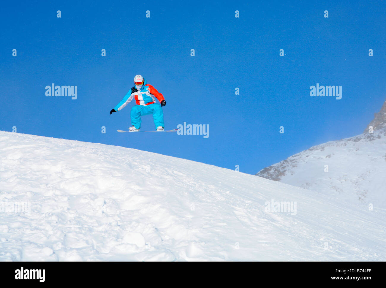 snowboarder at a funpark near mountain station Schaufeljoch on top of Stubai Glacier in Tyrol, Austria Stock Photo