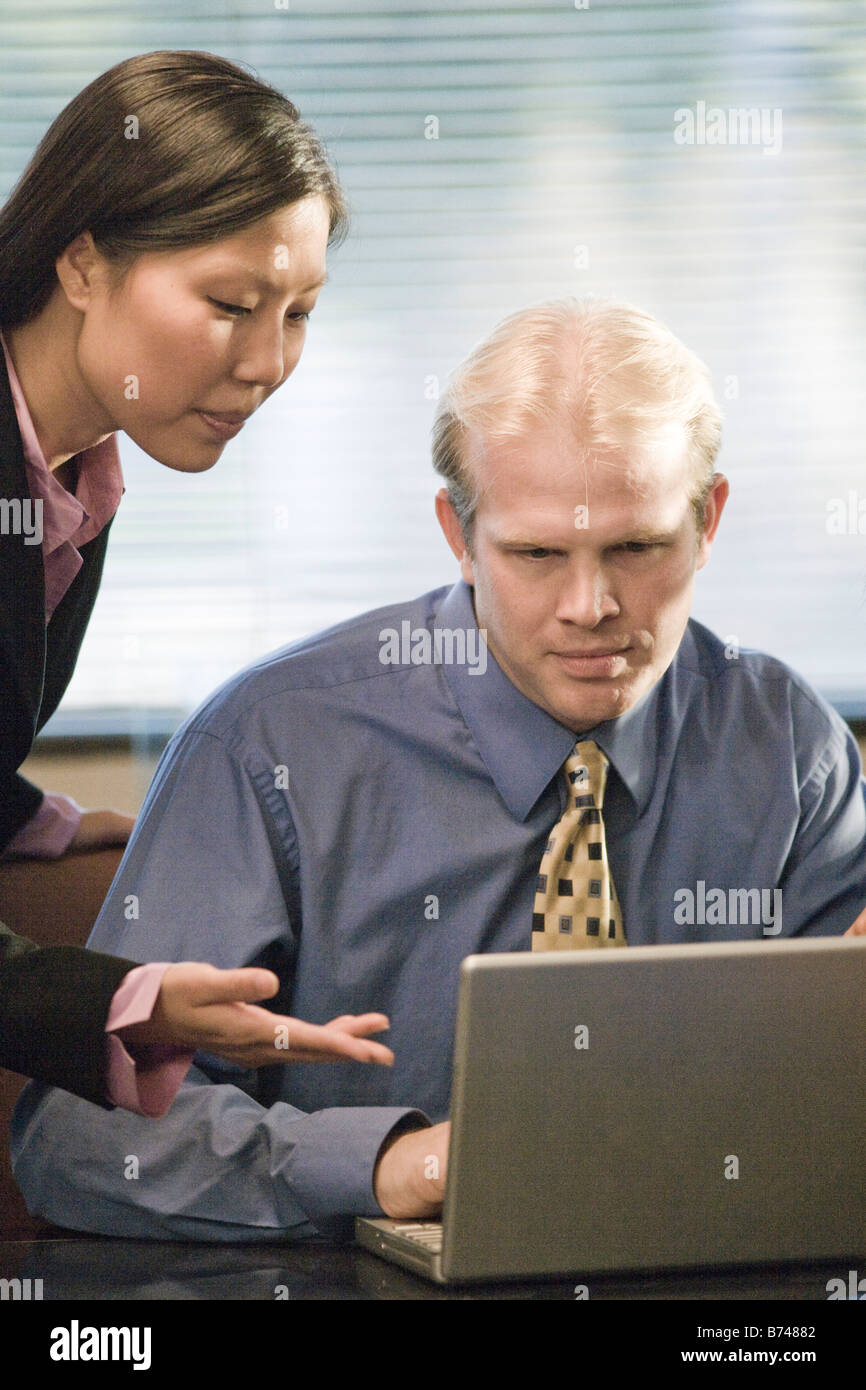 Office workers working on laptop Stock Photo Alamy