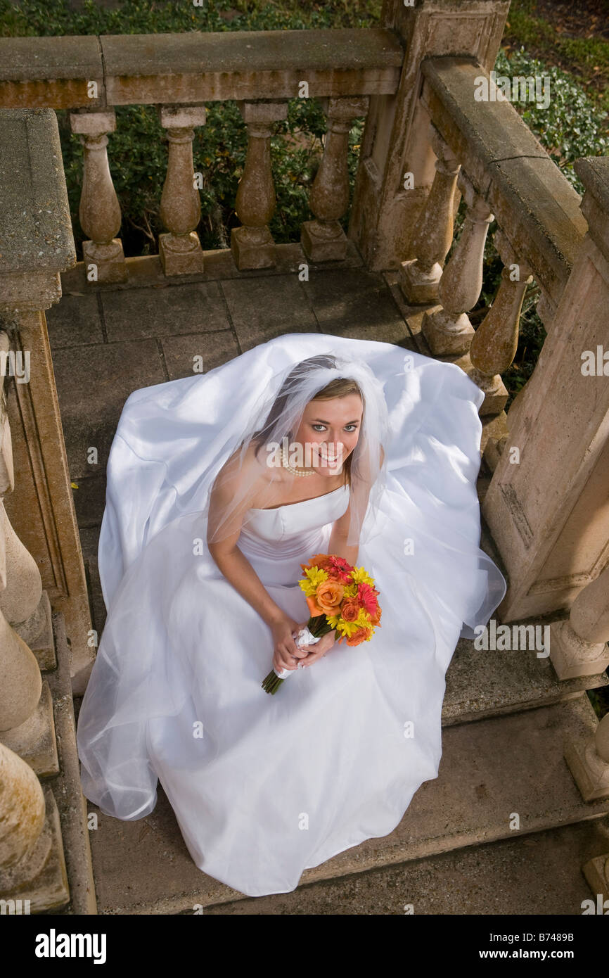 Bride sitting on stairs hi-res stock photography and images - Alamy