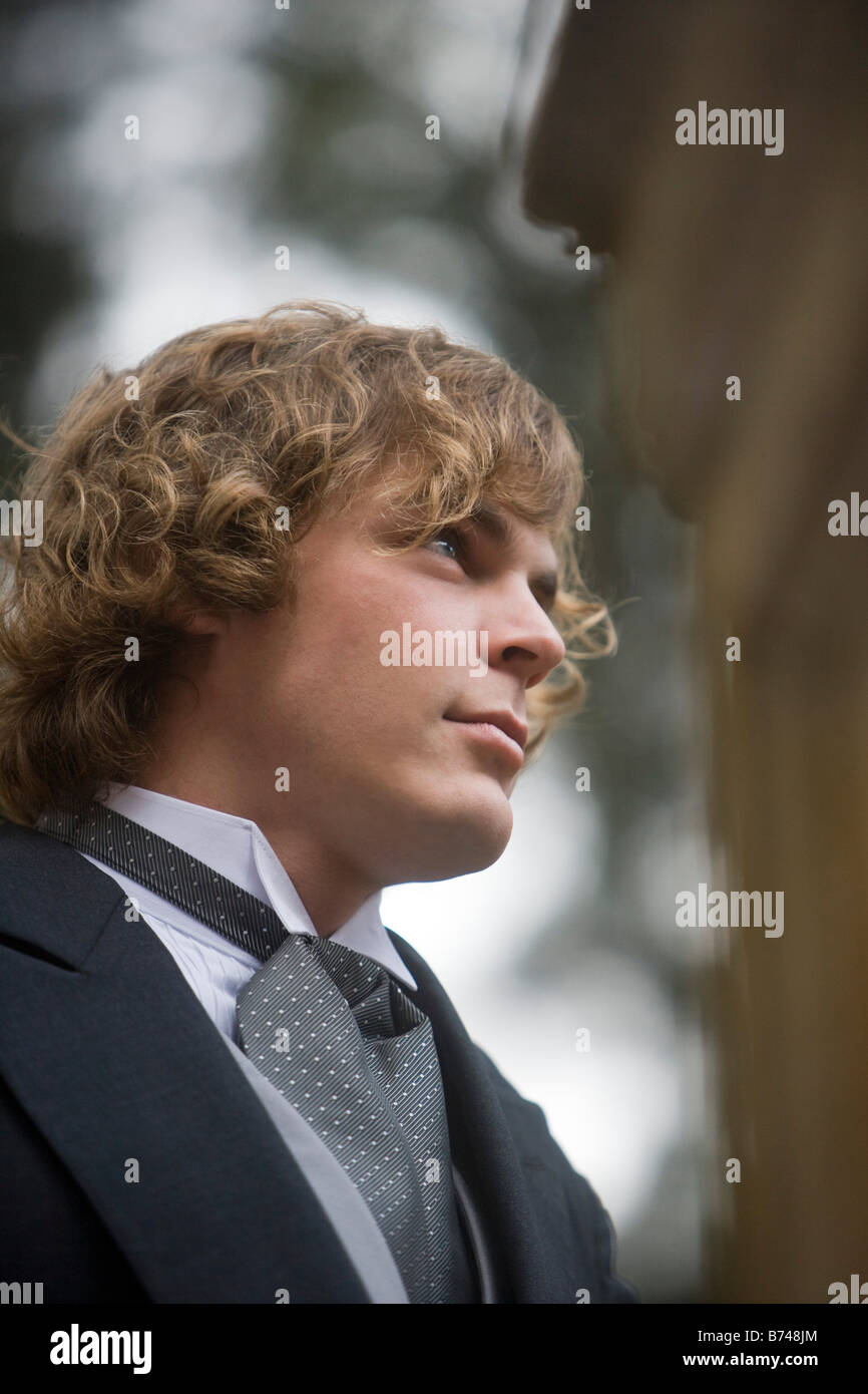 Young groom outside on wedding day, focus on foreground Stock Photo - Alamy