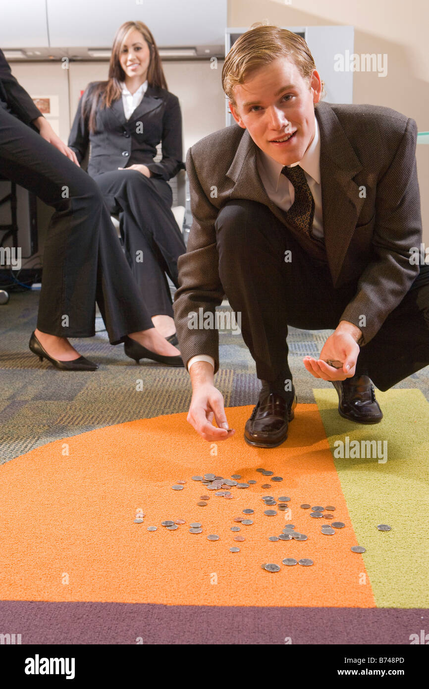 Office workers picking up money off floor Stock Photo 21607669 Alamy