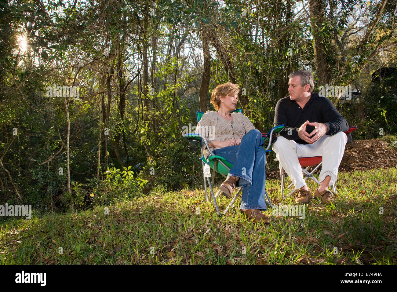 Woman sitting on camping hi-res stock photography and images - Alamy