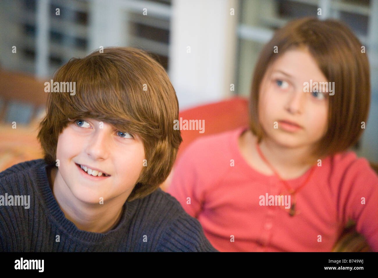 Portrait Of Brother And Sister Sitting Together On Porch Portrait Of Brother And Sister Sitting Together On Porch
