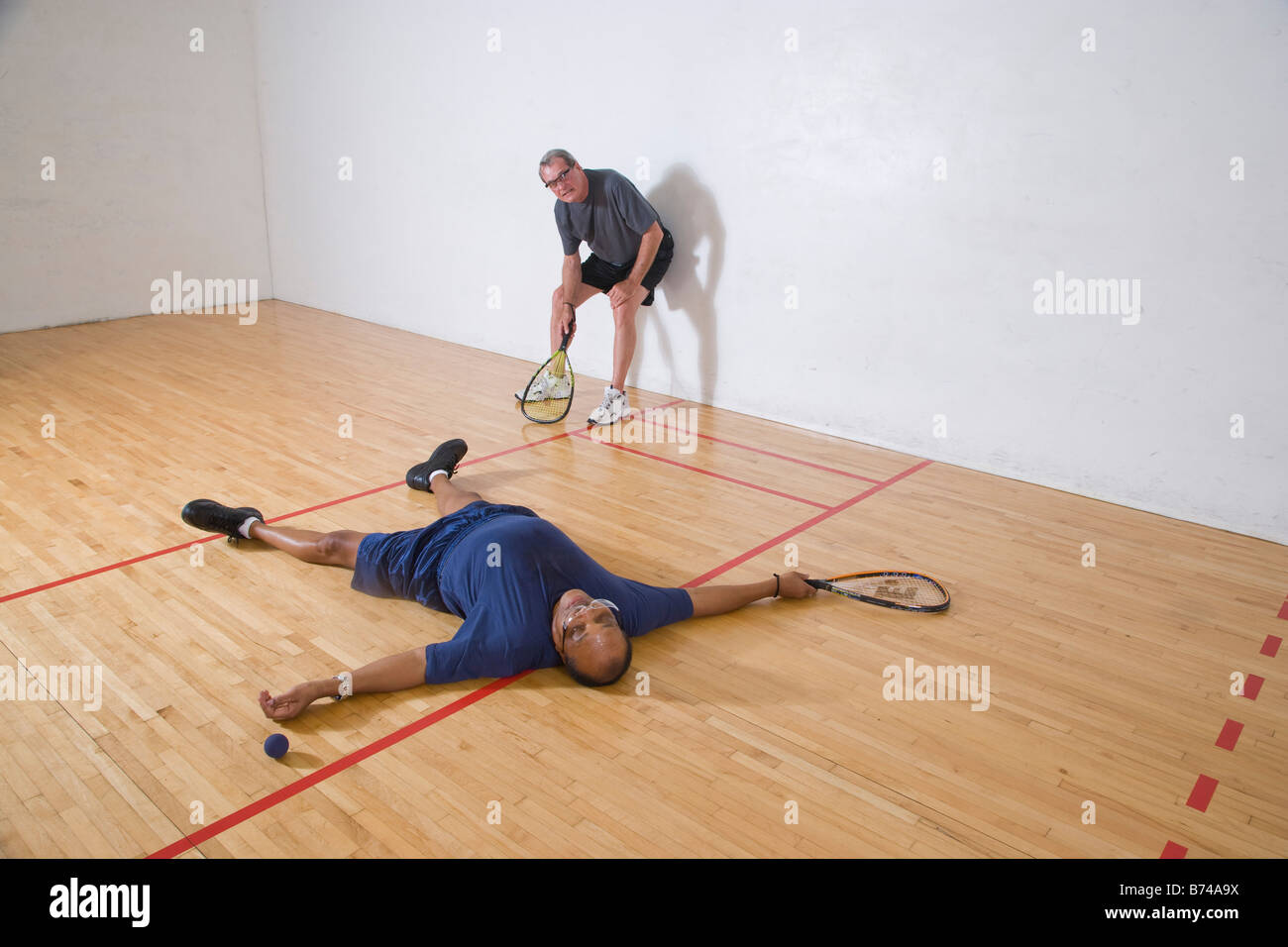 Senior men playing racketball, having fun Stock Photo - Alamy