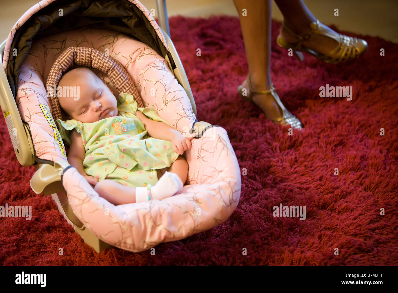 Baby asleep in a car seat Stock Photo Alamy