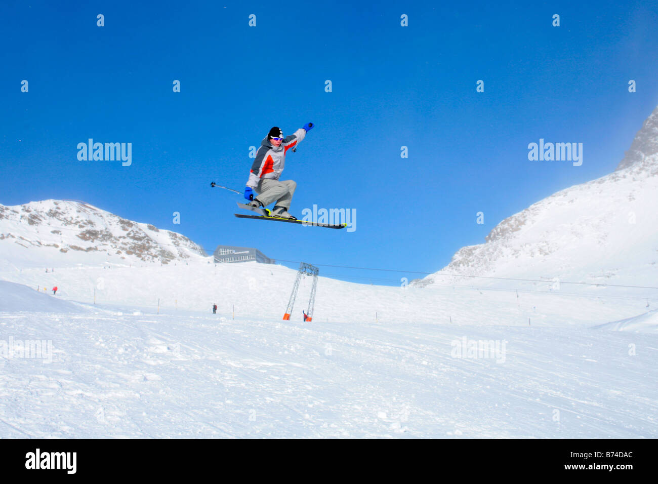 skier jumping at a funpark near mountain station Schaufeljoch on top of Stubai Glacier in Tyrol, Austria Stock Photo
