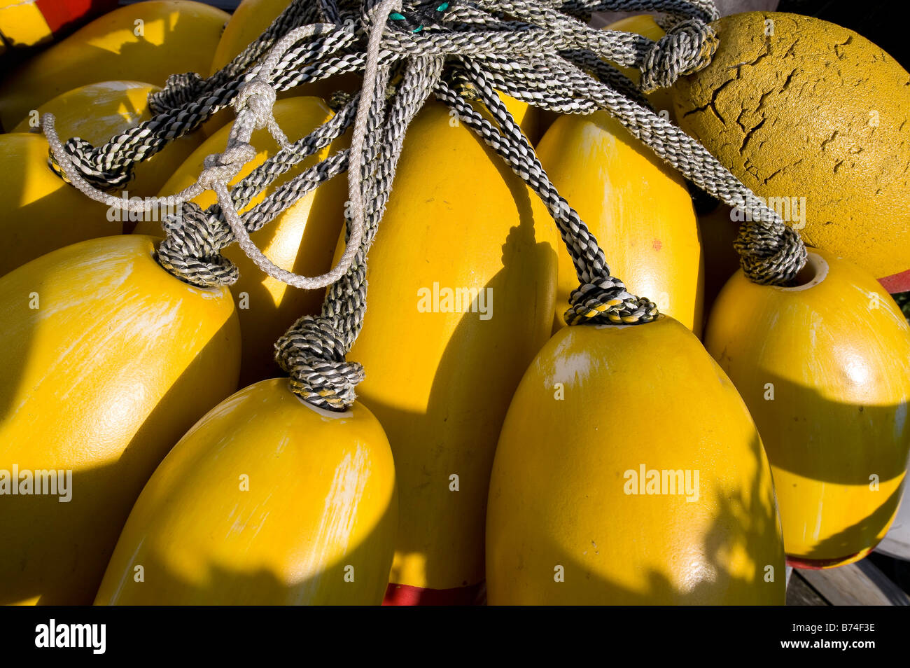 Yellow lobster buoys hi-res stock photography and images - Alamy